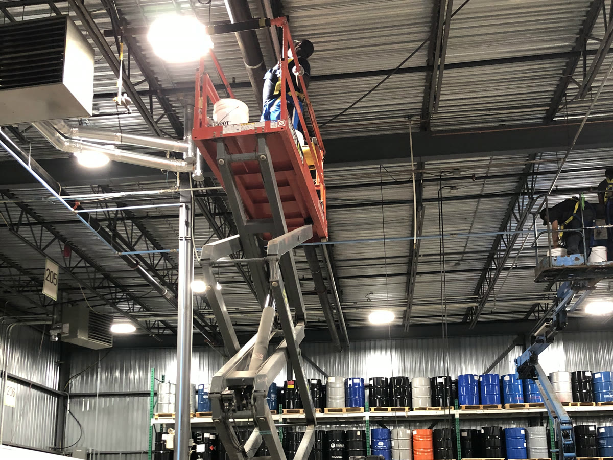 Nettoyage de structures en hauteur, usine d'emballage